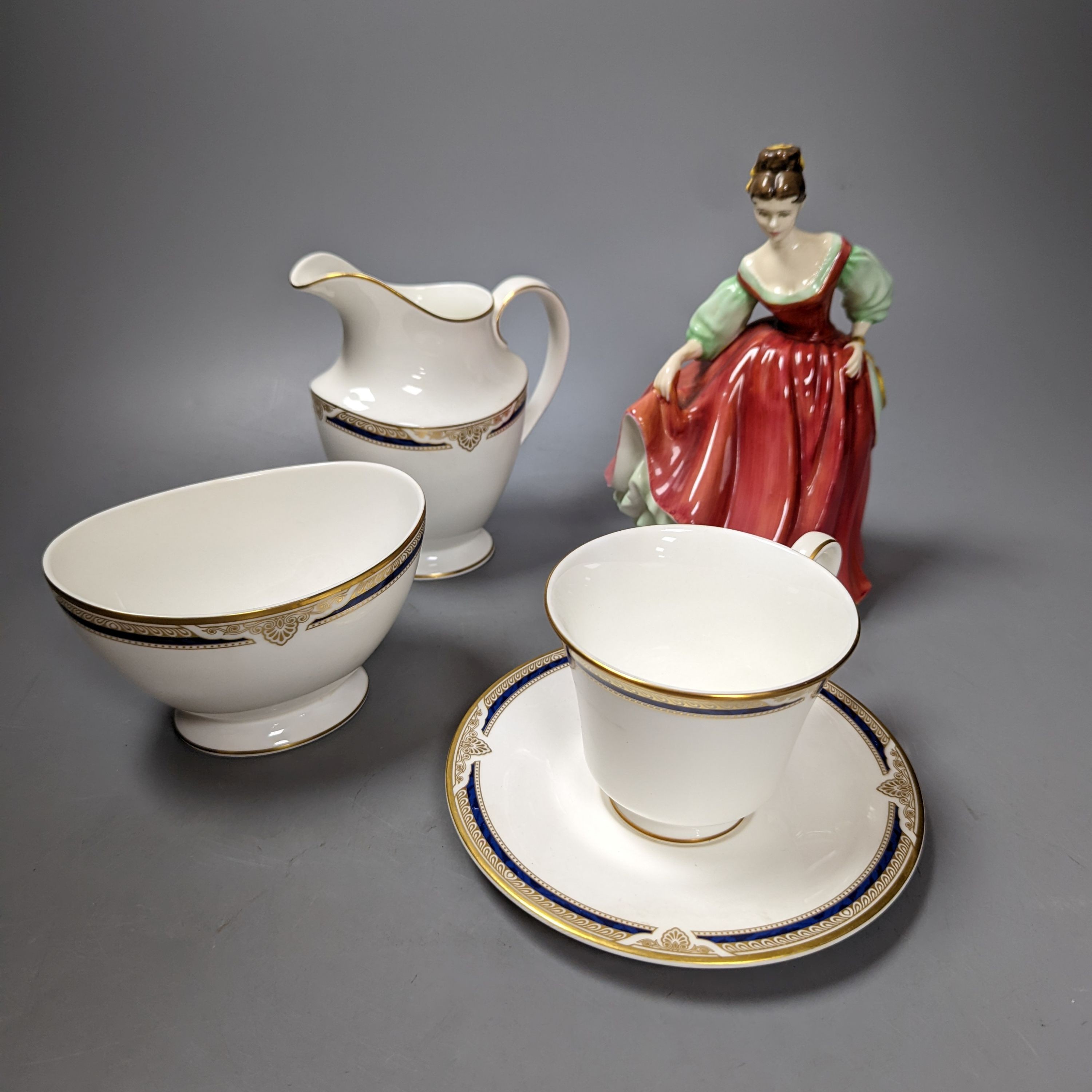 A Royal Doulton figure 'St Ellen' and a Royal Doulton St Helier teaset, figure 19 cms high.